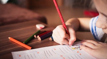 Child drawing on paper