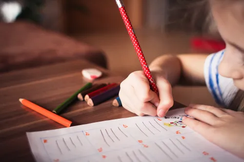 Child drawing on paper